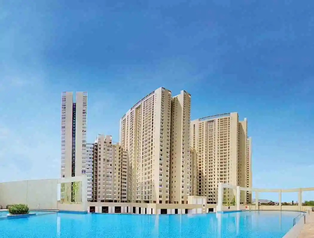 Sattva Panathur Bhoganahalli Residential towers rising behind a swimming pool in a Sattva Group community, artist's impression